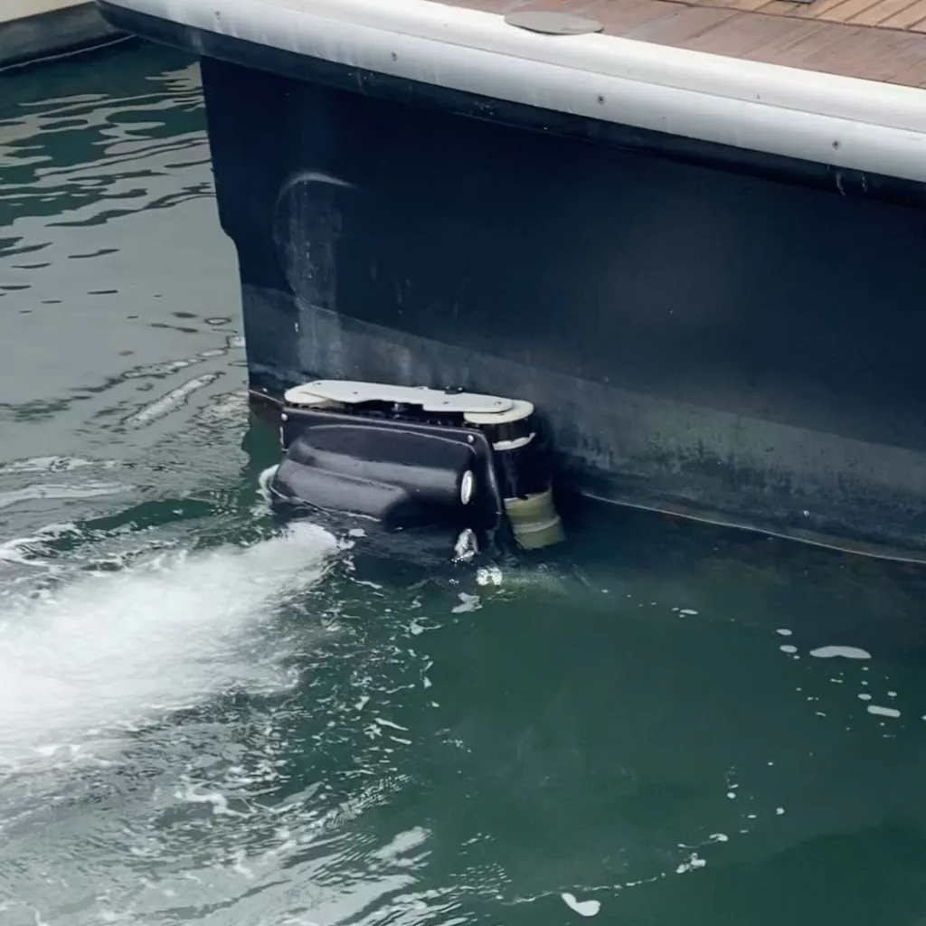 Underwater cleaning drone attached to a yacht hull