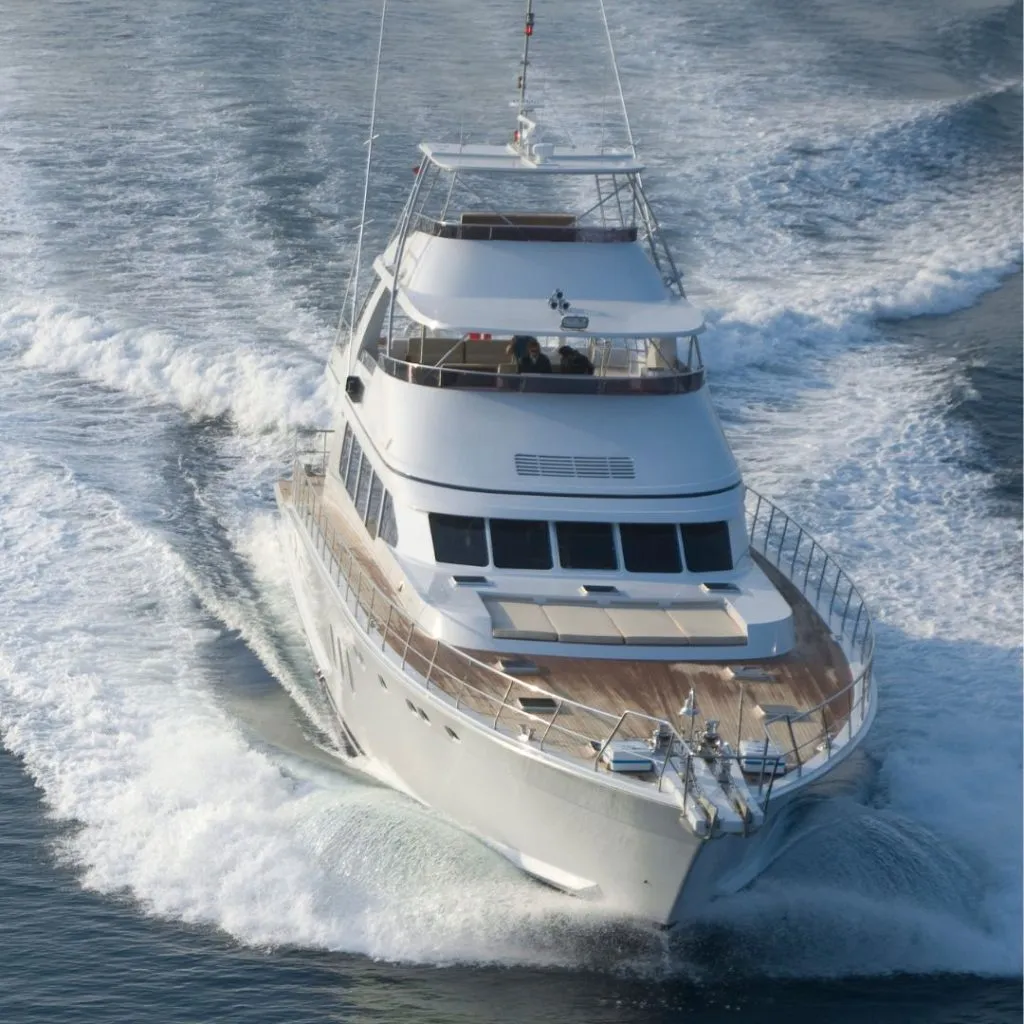 Motor yacht underway at speed on clean water